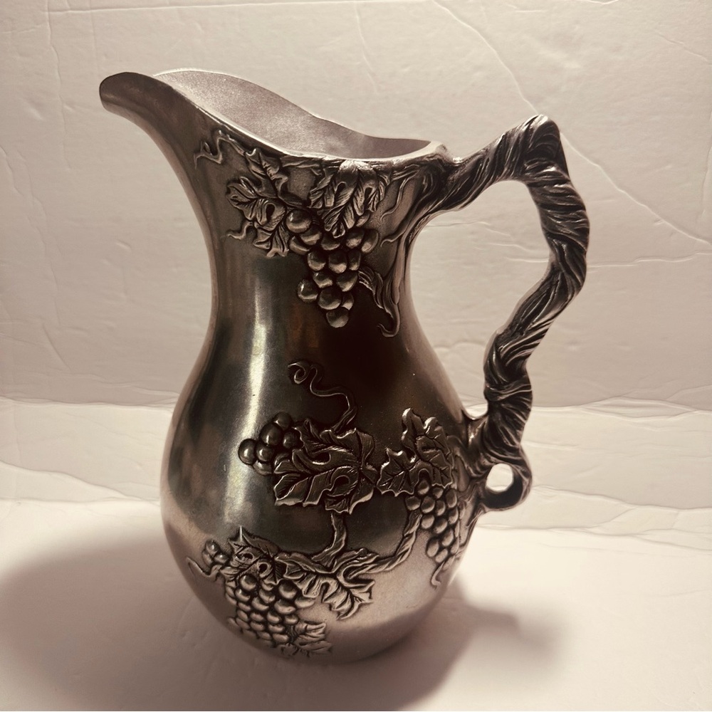 Elegant Silver Pitcher with Grape Design